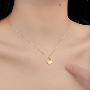 Minimalist 925 sterling silver necklace with bliss engraved oval pendant on neck