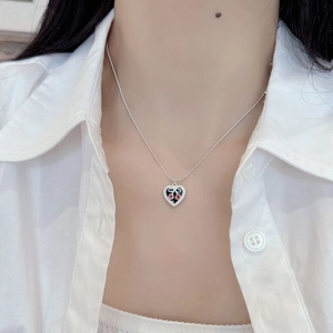 Vintage S925 silver necklace featuring a black heart pendant with red cherry design