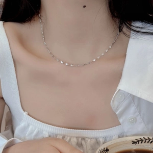 Minimalist S925 sterling silver lip necklace worn by a model in a lifestyle setting