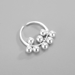 Macro shot of S925 sterling silver ring showing the hallmark and dangling silver beads