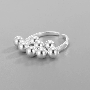 Macro detail of S925 sterling silver ring featuring polished metallic grape beads