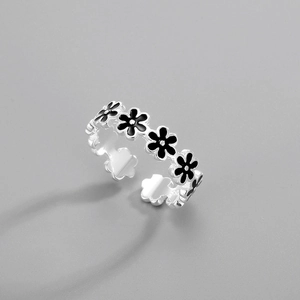 Detailed view of S925 silver ring featuring black enamel flowers and adjustable opening