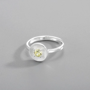 Close-up of S925 silver ring featuring a yellow sunburst zircon with adjustable band