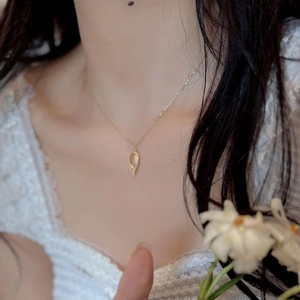 Elegant gold matte geometric irregular pendant necklace on model with minimalist style