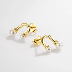 Close-up of S925 sterling silver hallmarked earring with minimalist pearl accents