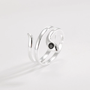 Detail of S925 sterling silver wrap ring with snake design and black gemstone