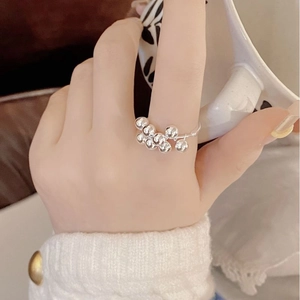 Detail of S925 sterling silver grape bead ring worn on hand in a cozy lifestyle setting