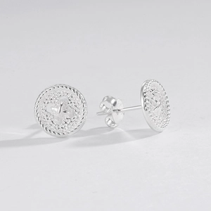 Macro view of vintage button sterling silver stud earrings with rope texture details