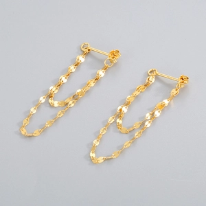Macro shot of S925 hallmark on minimalist gold tassel chain earrings for women