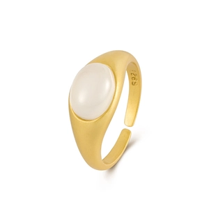 Matte gold S925 silver ring featuring an oval white chalcedony stone on a white background