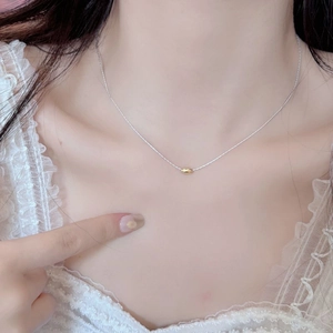 Minimalist S925 sterling silver necklace with a polished gold oval bead pendant