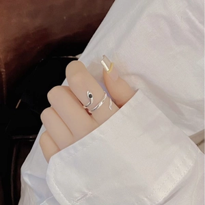 Vintage S925 sterling silver snake ring with black gemstone detail on finger