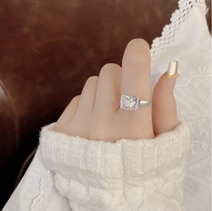 Elegant S925 sterling silver ring featuring a square-cut zircon stone on a model finger