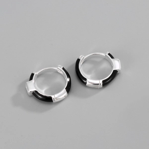Detailed view of silver S925 earrings with modern black enamel geometric inlay design