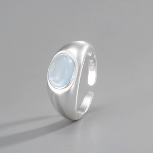 Close-up of S925 silver hallmark and oval aquamarine on adjustable crystal ring
