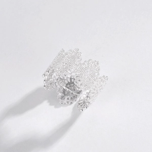 Close-up of S925 sterling silver ring showing intricate vintage hollow lace floral details