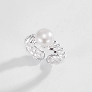 Detail of S925 sterling silver twist ring with a natural round white pearl