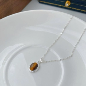S925 sterling silver necklace with oval tiger eye stone pendant in milgrain style