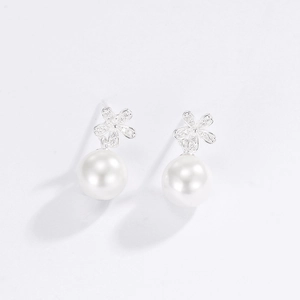 Close-up of S925 silver flower earrings with pave zircon and white shell pearls