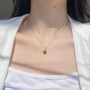 French vintage S925 silver necklace featuring an oval tiger eye stone on a gold chain