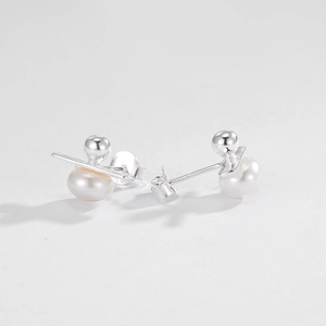 Close-up of S925 sterling silver bar earrings with white freshwater pearls