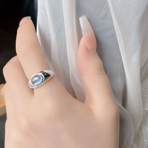 Close-up of S925 sterling silver ring with natural aquamarine stone on a female hand