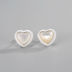 Close-up of S925 sterling silver heart studs with white mother of pearl and rope edge