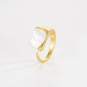 Macro detail of S925 sterling silver hallmark and white shell inlay on adjustable ring