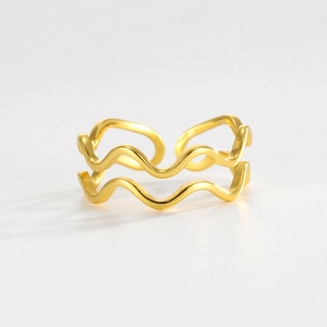 Detail of 925 sterling silver double layer wave ring in gold finish with open design
