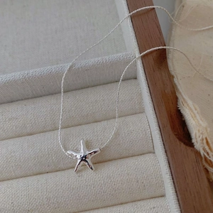 S925 sterling silver starfish necklace with lava texture on minimalist box display
