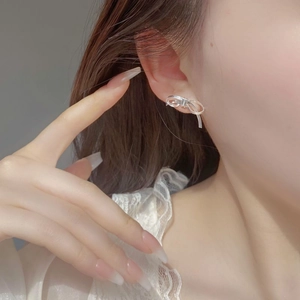 Minimalist 925 sterling silver bow stud earrings with a refined matte brushed finish