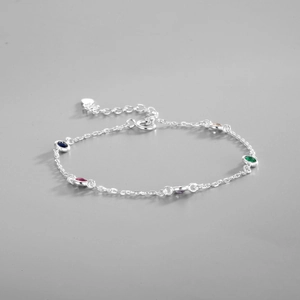Close-up of S925 silver bracelet with multi-colored round gemstones and heart charm