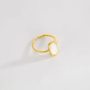 Detail of S925 sterling silver ring featuring a polished oval white shell inlay