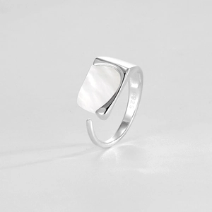 Detailed close-up of S925 sterling silver ring with rectangular shell inlay and engraving