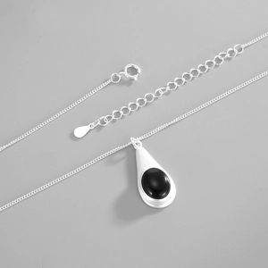 Close-up of S925 sterling silver water drop pendant with black onyx and matte finish