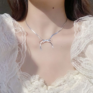 Elegant S925 sterling silver blade chain necklace with a 3D bow pendant for women