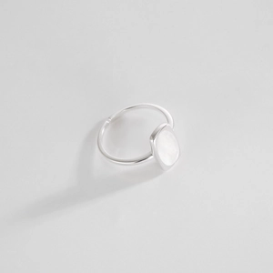 Detail shot of rectangular white shell inlay on minimalist S925 sterling silver ring