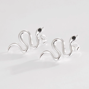 Detail view of S925 sterling silver snake earrings with black zircon eyes and hallmark