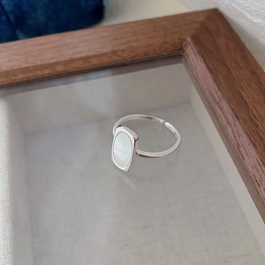 Close-up of S925 sterling silver adjustable ring with rectangular white mother of pearl