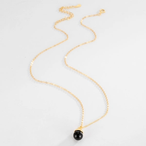 Detail of S925 silver gold-plated O-chain with black onyx ball and lobster clasp