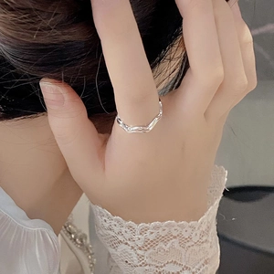 Macro shot of 925 sterling silver double layer wavy ring with fluid curved design