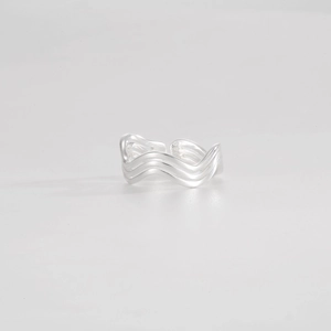 Macro detail of S925 sterling silver stamp on vintage geometric wavy adjustable ring