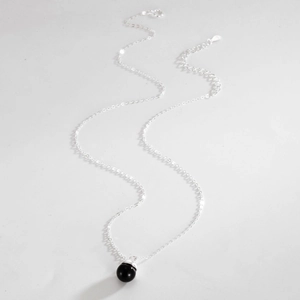 Close-up of S925 sterling silver chain with black onyx bead pendant and lobster clasp