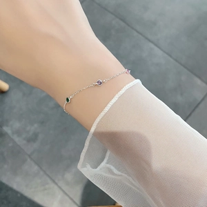 Close-up of S925 silver bracelet with colorful round gemstones worn on a wrist