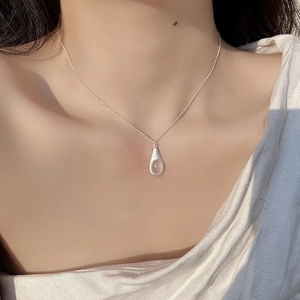S925 sterling silver teardrop necklace with moonstone pendant on a female model