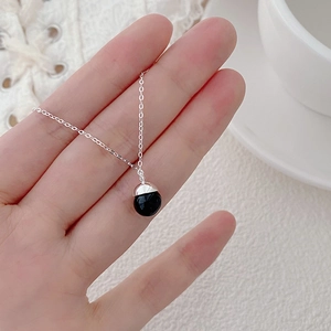 Minimalist S925 sterling silver necklace featuring a round black agate stone pendant