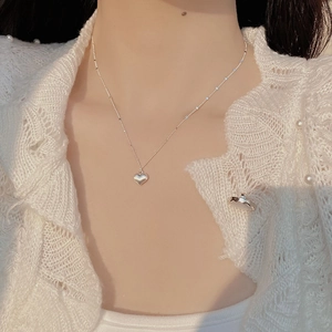 Elegant S925 sterling silver brushed heart pendant necklace worn on a female model