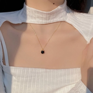 Minimalist S925 silver necklace with black agate bead pendant worn on model