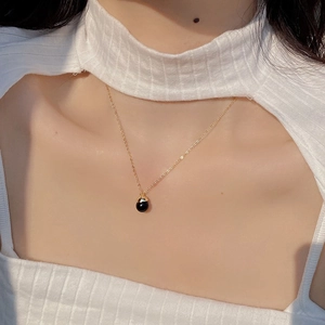 Minimalist S925 sterling silver gold necklace featuring a round black onyx bulb pendant