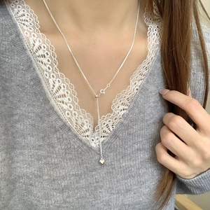 925 silver Y-shaped tassel heart necklace with adjustable sliding buckle on a model